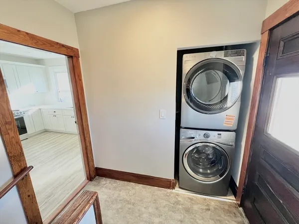 a view of a storage and utility room with washer and dryer