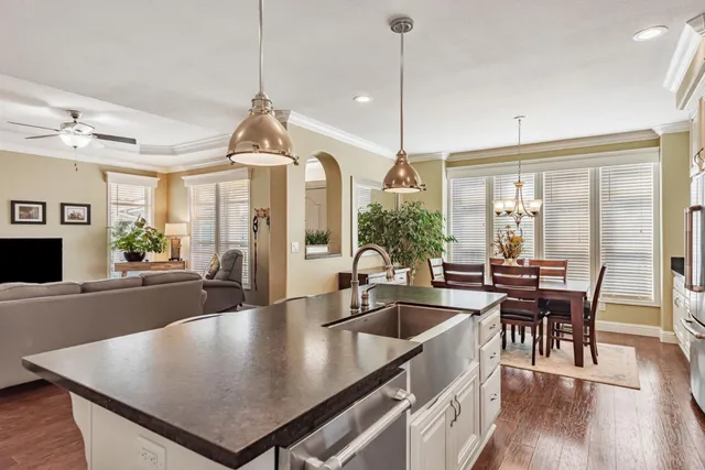 a kitchen with sink table and chairs