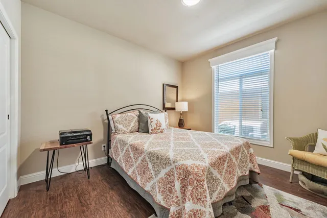 a bedroom with a bed and a window