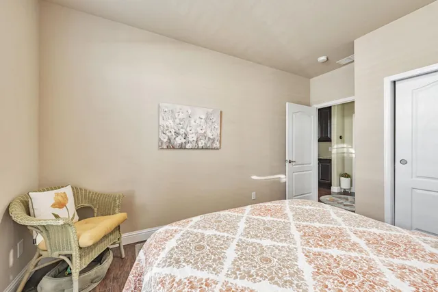 a bedroom with a bed and a chair