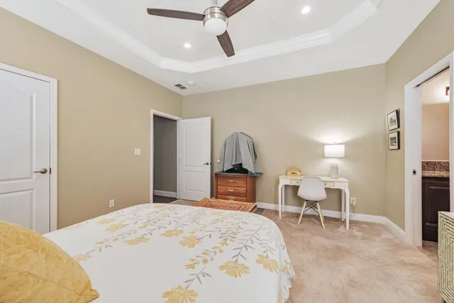 a bedroom with a bed and a chair