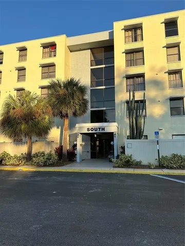 a tall buildings sitting next to a road