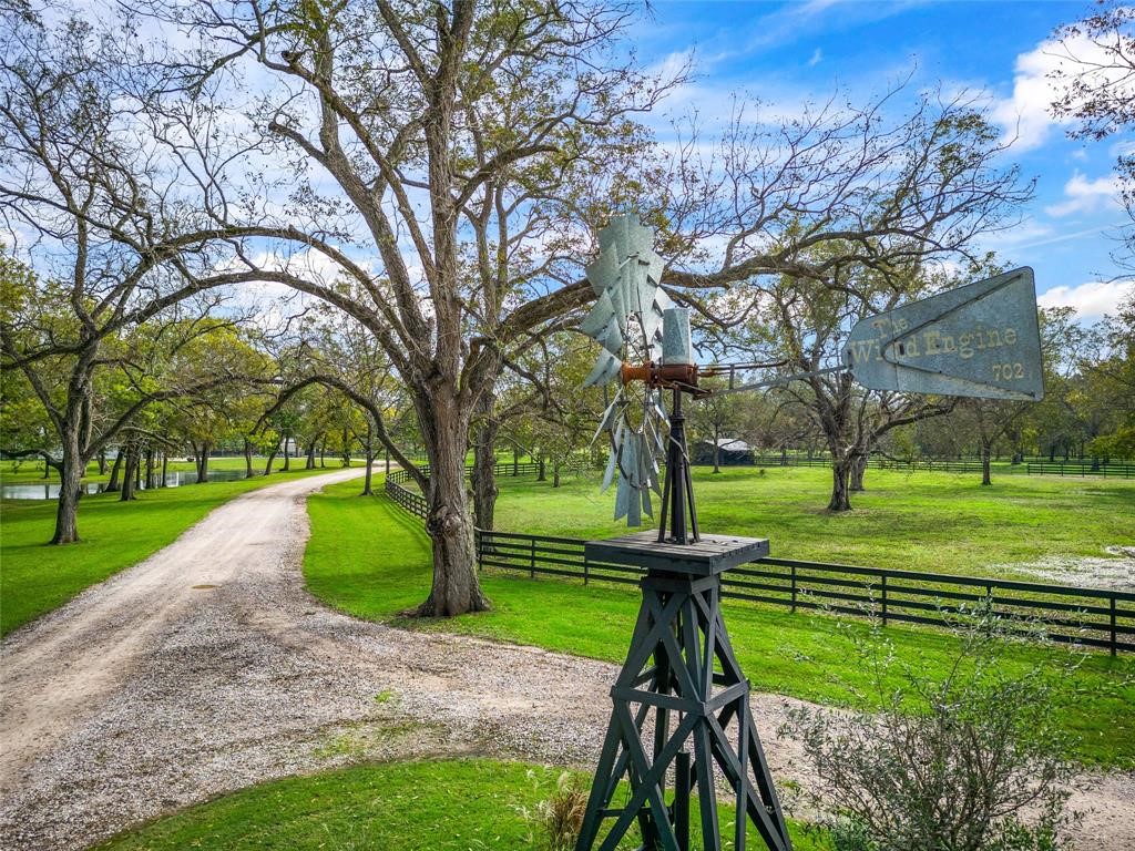 2990 Bowser Road Fulshear, TX 77441 - Photo 2 of 9 a view of a park with large trees