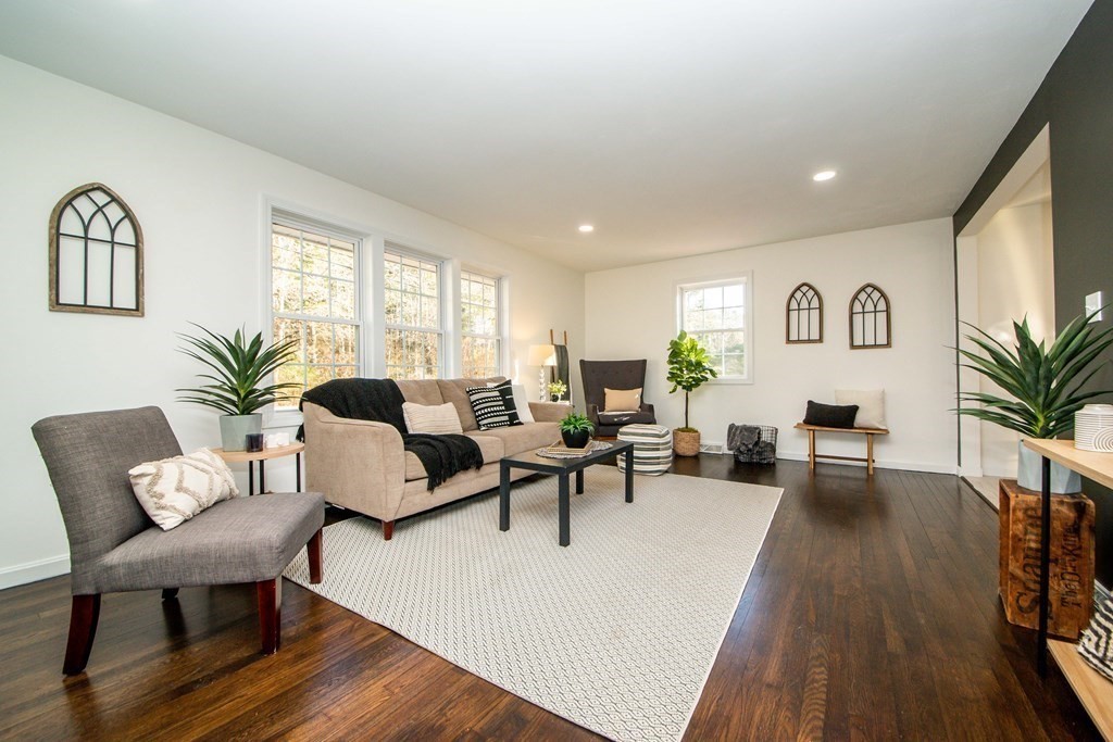 213 Walnut Plain Road Rochester, MA 02770 - Photo 5 of 38 a living room with furniture and a wooden floor