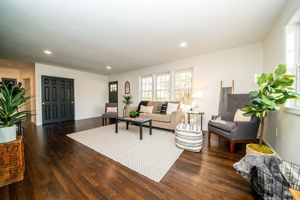 213 Walnut Plain Road Rochester, MA 02770 - Photo 6 of 38 a living room with furniture and a wooden floor
