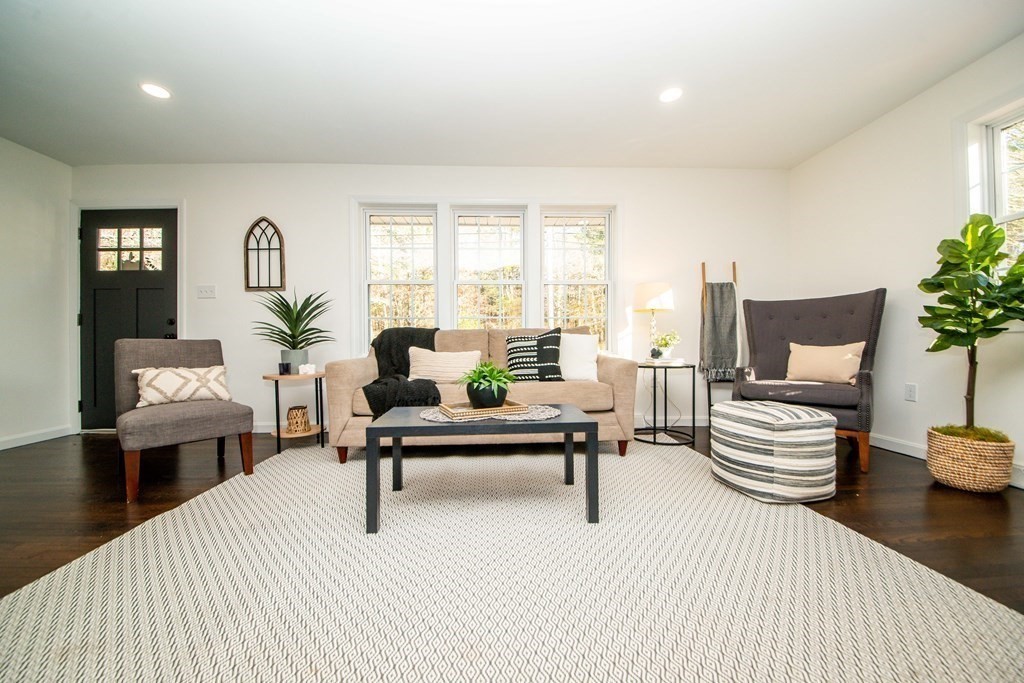 213 Walnut Plain Road Rochester, MA 02770 - Photo 7 of 38 a living room with furniture and a potted plant