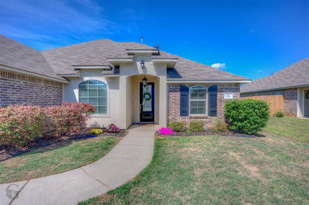 233 Sedgewick Avenue Haughton, LA 71037 - Photo 2 of 19 a front view of a house with a yard