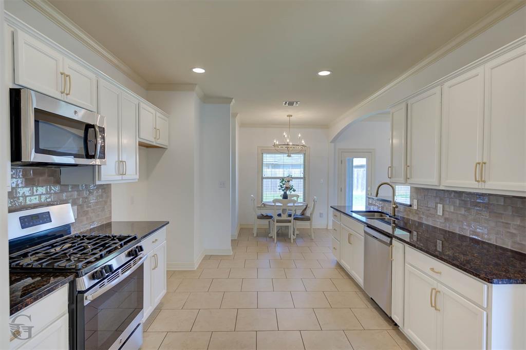 233 Sedgewick Avenue Haughton, LA 71037 - Photo 8 of 19 a kitchen with stainless steel appliances granite countertop a sink stove and cabinets