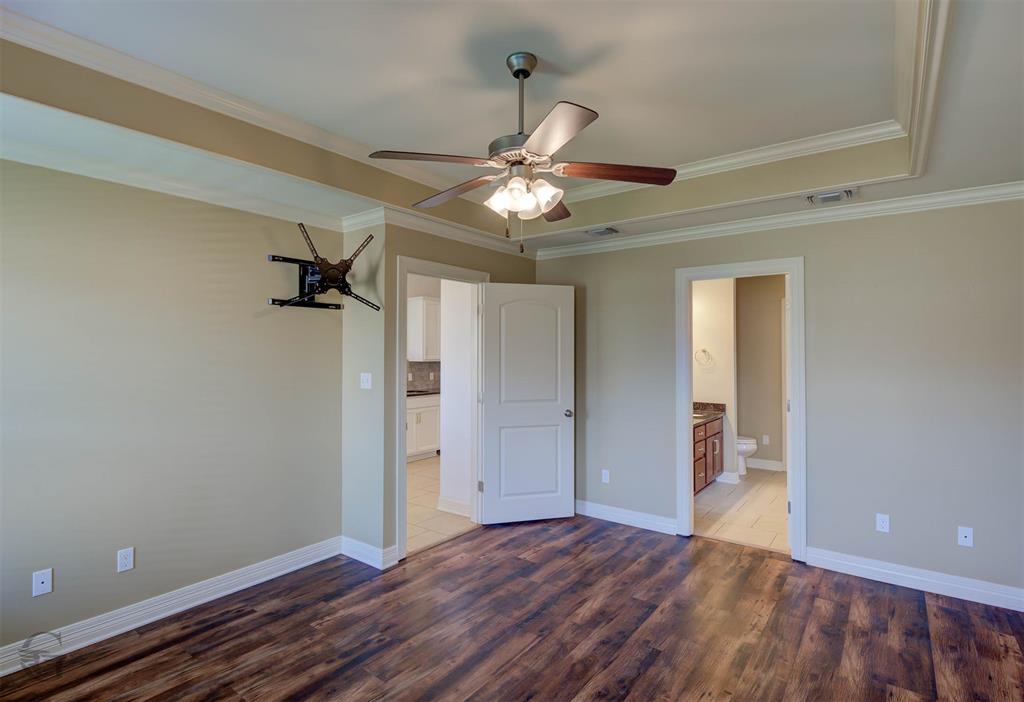 233 Sedgewick Avenue Haughton, LA 71037 - Photo 9 of 19 a view of a room with a ceiling fan window and wooden floor
