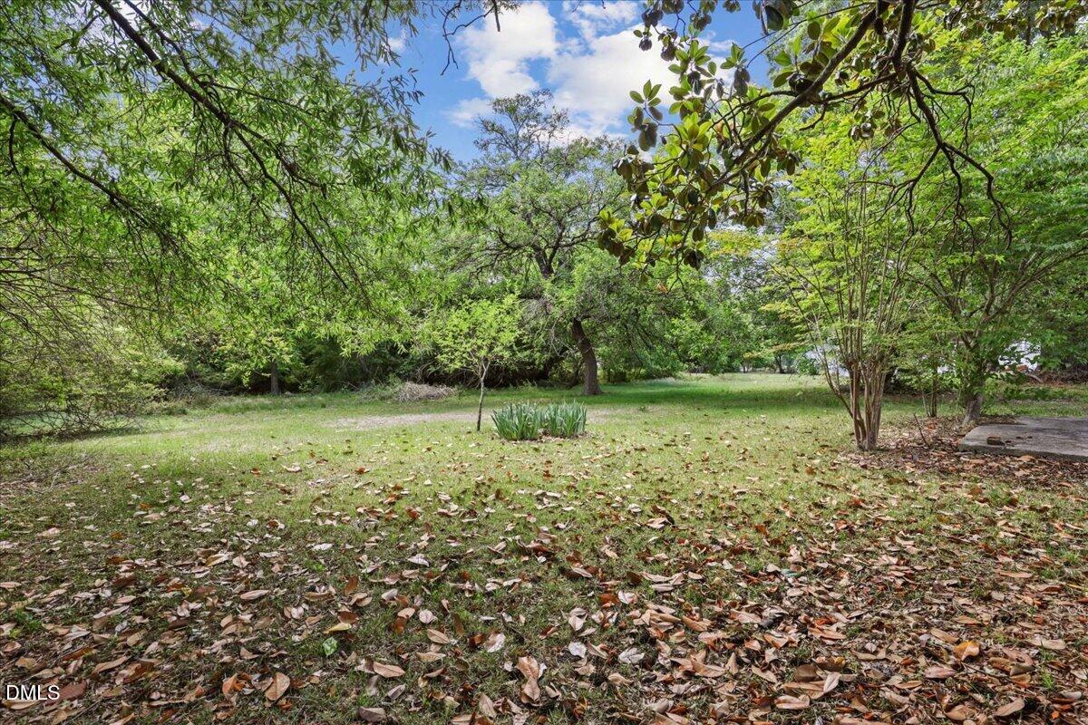 2213 Hunter Hill Road Rocky Mount, NC 27804 - Photo 10 of 11 a view of outdoor space with deck and yard