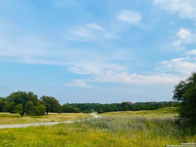a view of lake with green field