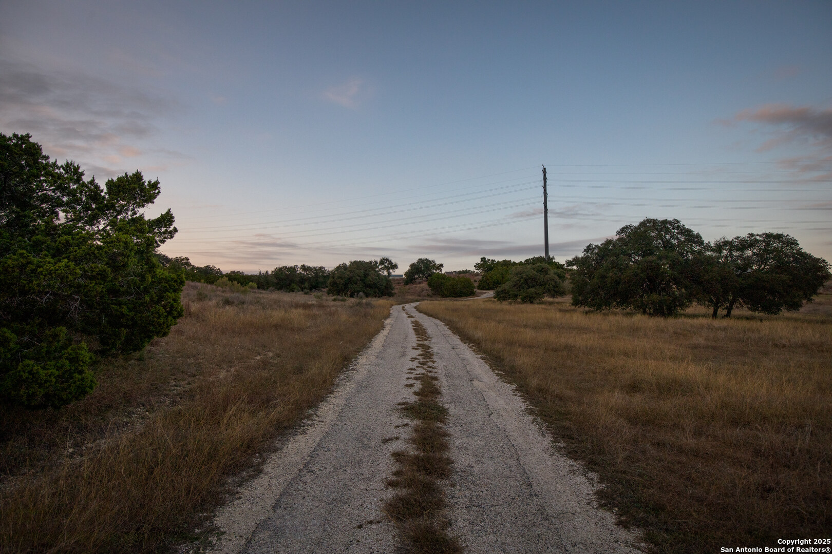 1822 Shepherds Ranch Bulverde, TX 78163 - Photo 22 of 25 a view of a street with a yard and lake view