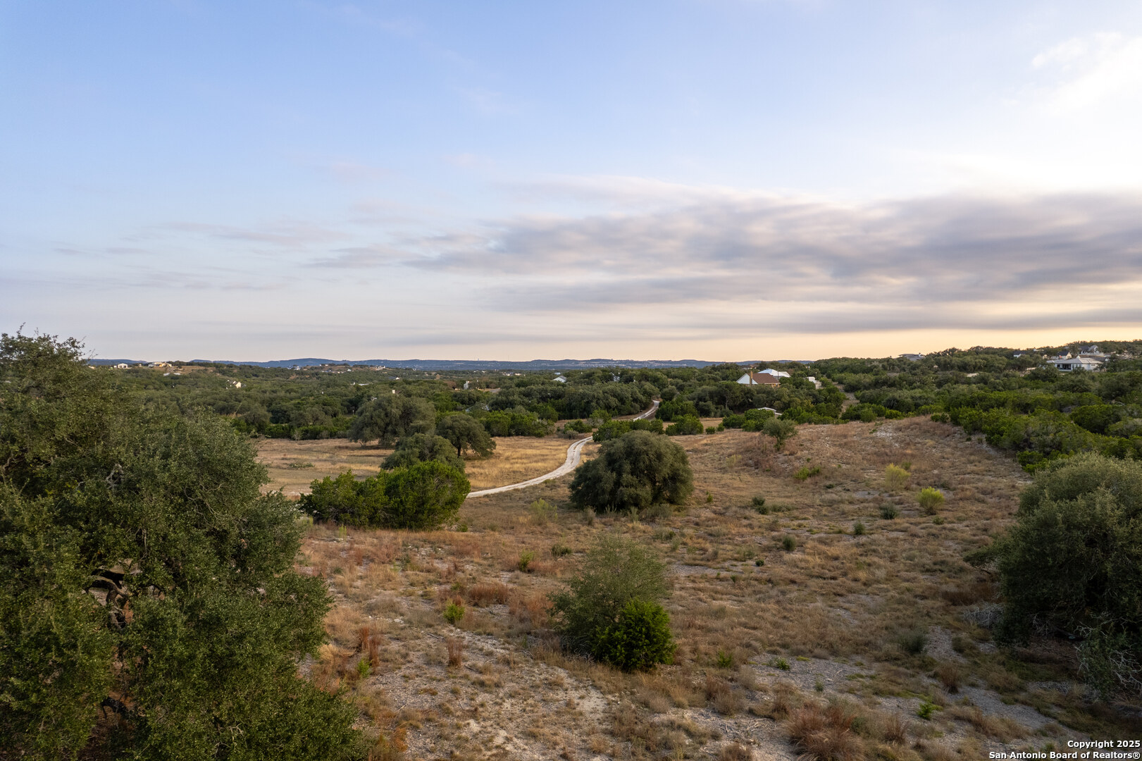 1822 Shepherds Ranch Bulverde, TX 78163 - Photo 23 of 25 a view of a lake with mountain in the background