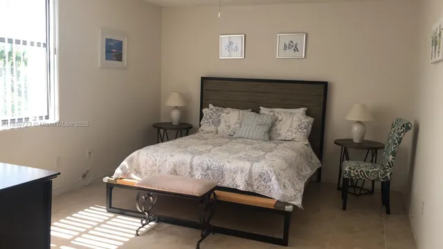a bedroom with a bed and a table