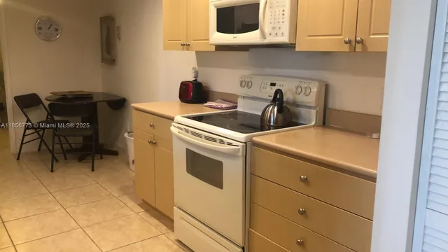 a kitchen with a stove and a microwave