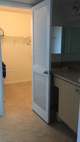 a bathroom with a shower and a sink