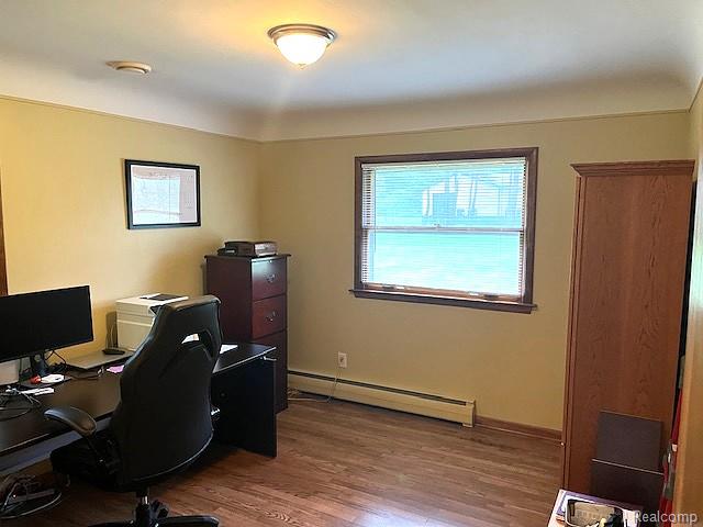 20285 29 Mile Road Ray, MI 48096 - Photo 17 of 25 Room featuring wood-finish flooring, a window with blinds, and a ceiling-mounted light fixture