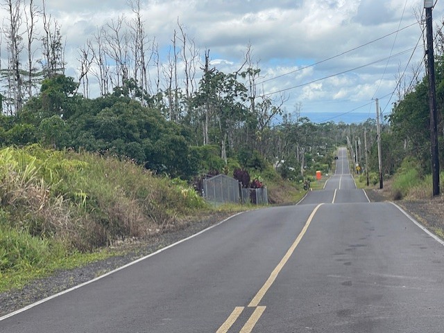 16-2143 Lot 71 Tradewind Drive Pahoa, HI 96778 - Photo 2 of 10 a view of a street with a yard and large trees