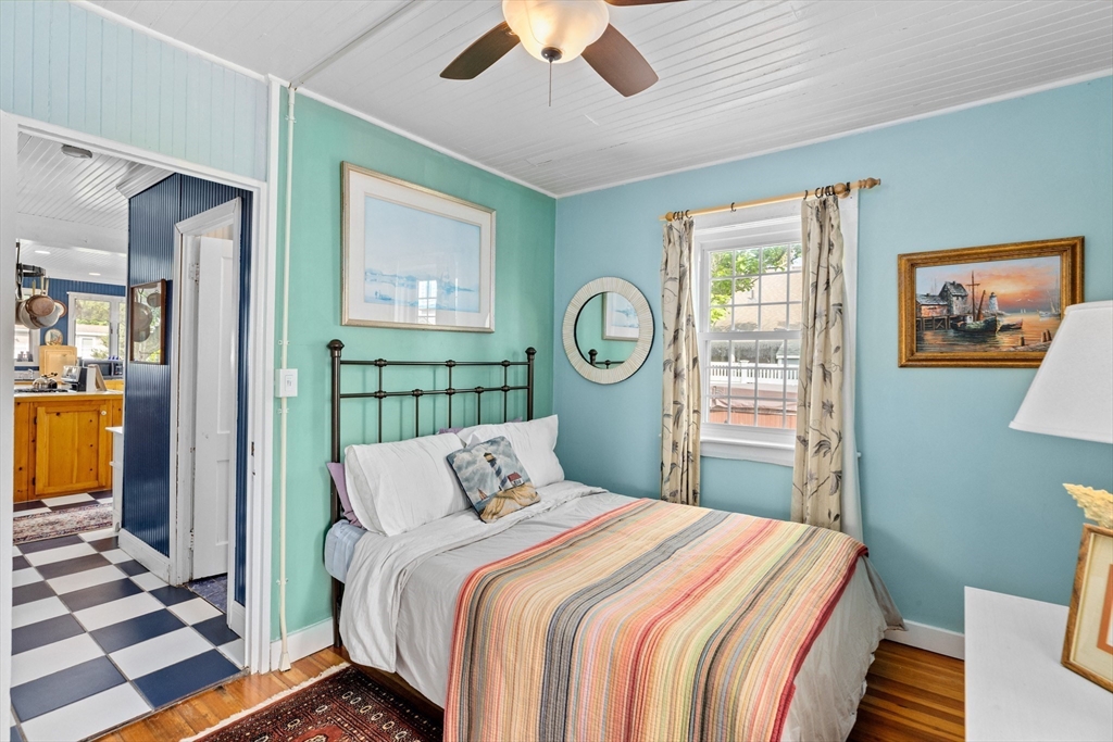 79 Kenneth Road Scituate, MA 02066 - Photo 17 of 39 a bedroom with a bed and glass door