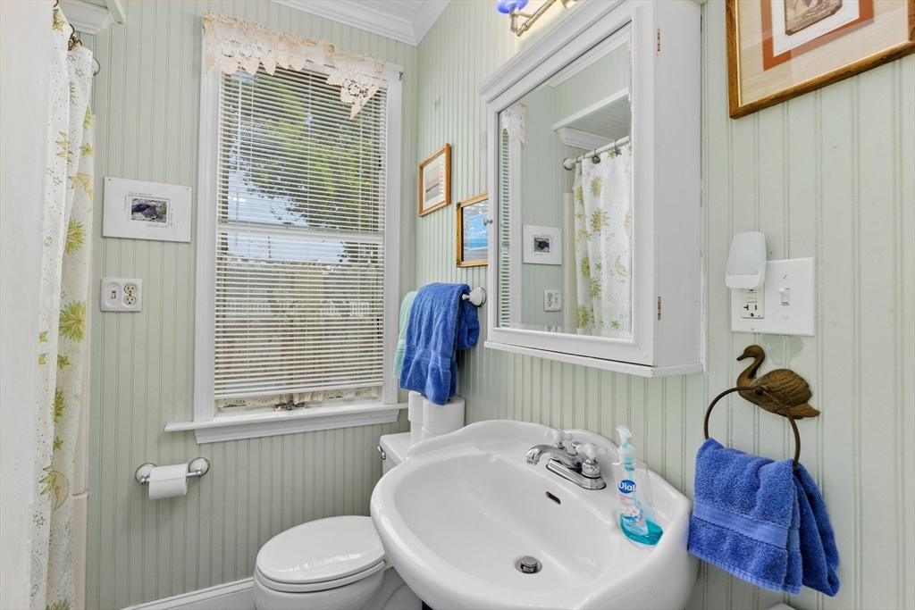 79 Kenneth Road Scituate, MA 02066 - Photo 18 of 39 a bathroom with a sink and a toilet