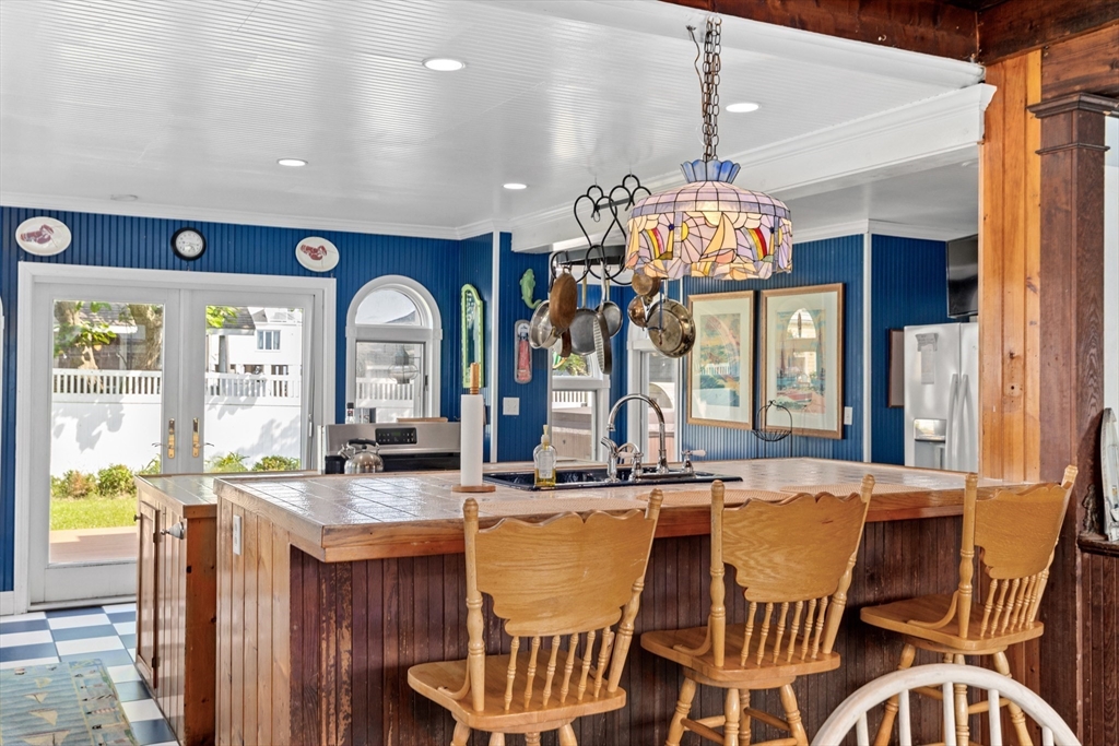 79 Kenneth Road Scituate, MA 02066 - Photo 6 of 39 a view of a dining room with furniture a chandelier and wooden floor