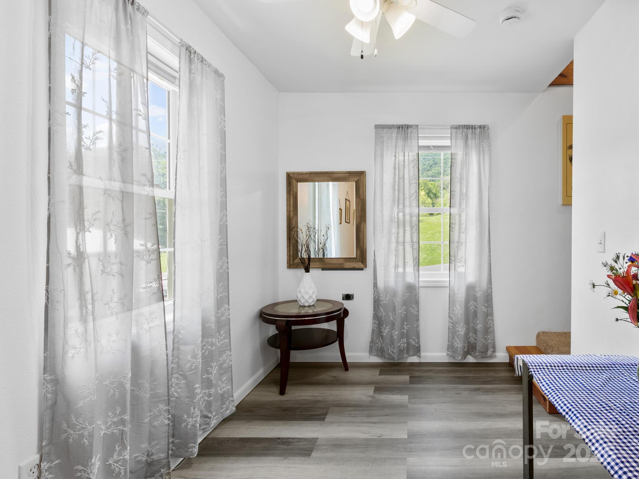 186 Wiggins Road Candler, NC 28715 - Photo 11 of 32 a living room with furniture and a window