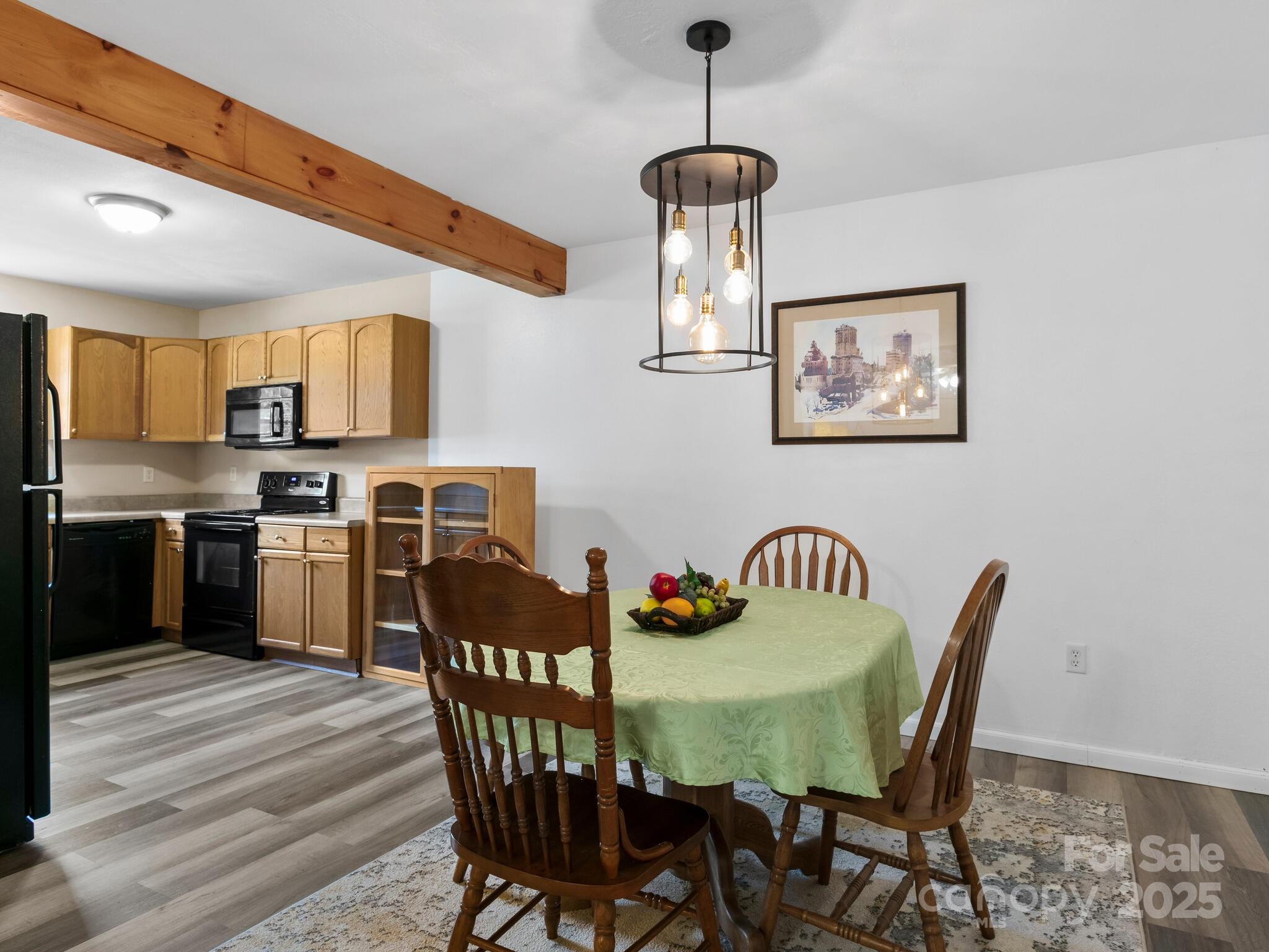 186 Wiggins Road Candler, NC 28715 - Photo 13 of 32 a view of a dining room with furniture