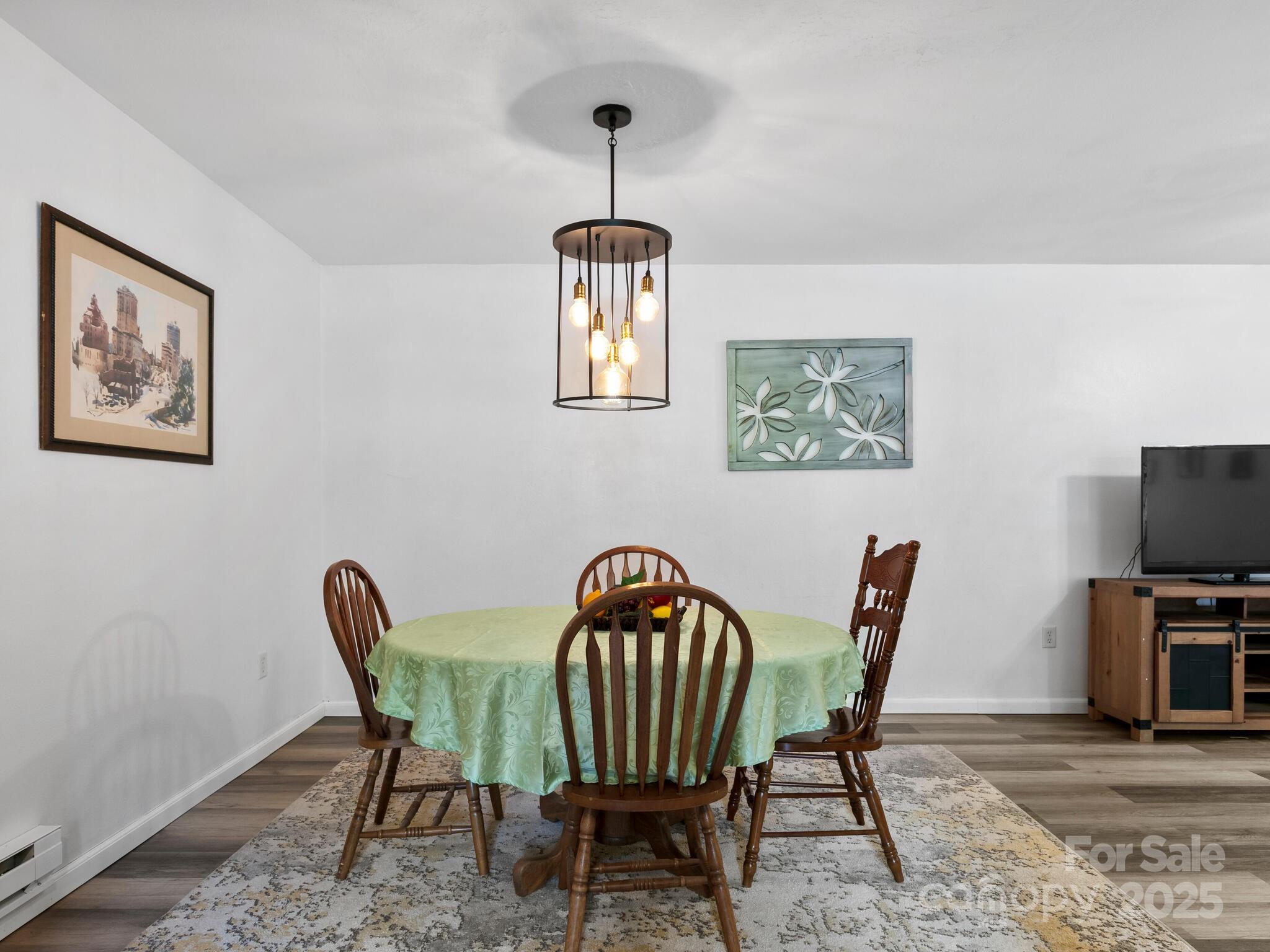 186 Wiggins Road Candler, NC 28715 - Photo 18 of 32 a view of a dining room with furniture