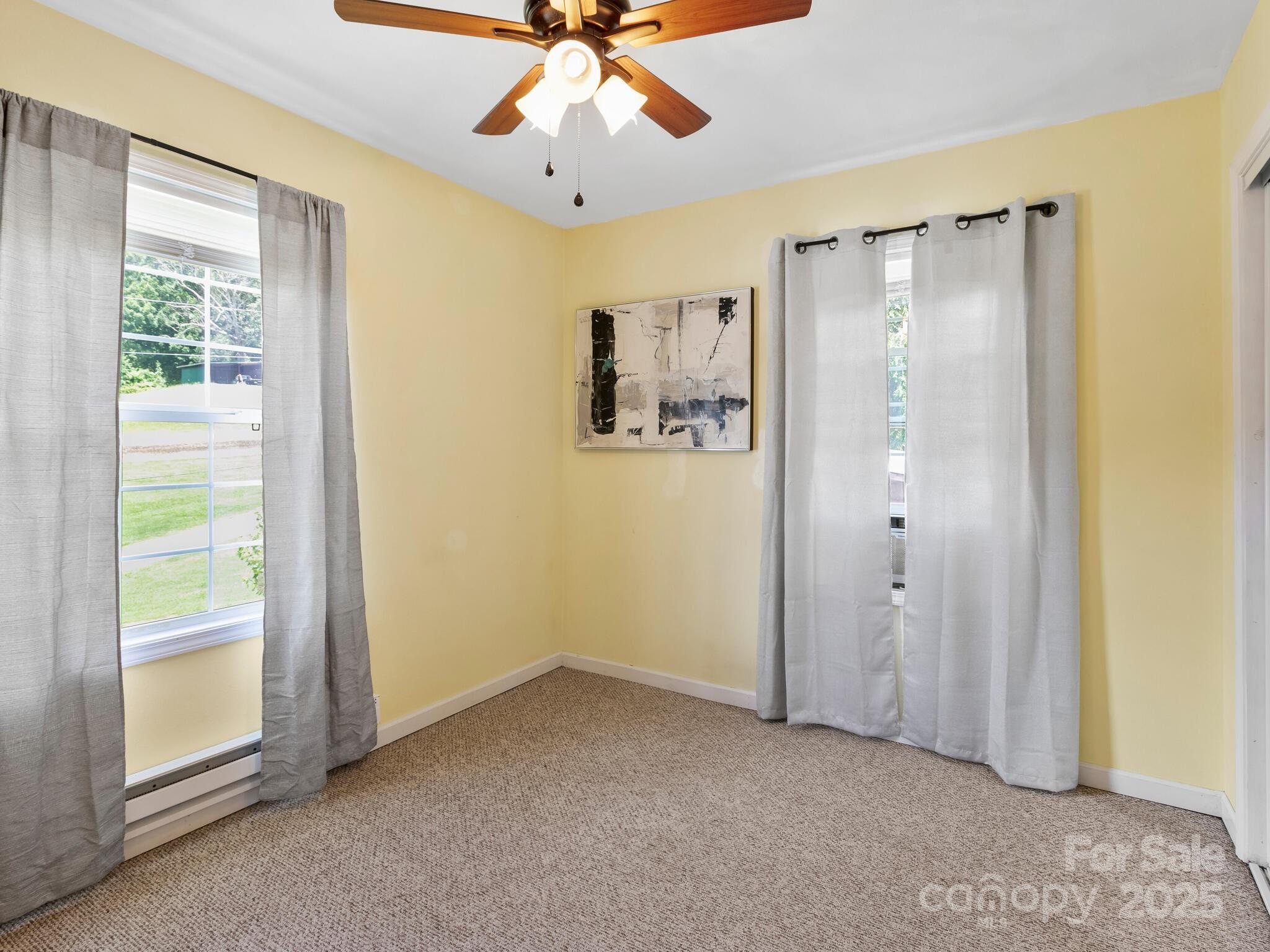 186 Wiggins Road Candler, NC 28715 - Photo 26 of 32 a view of an empty room with a window