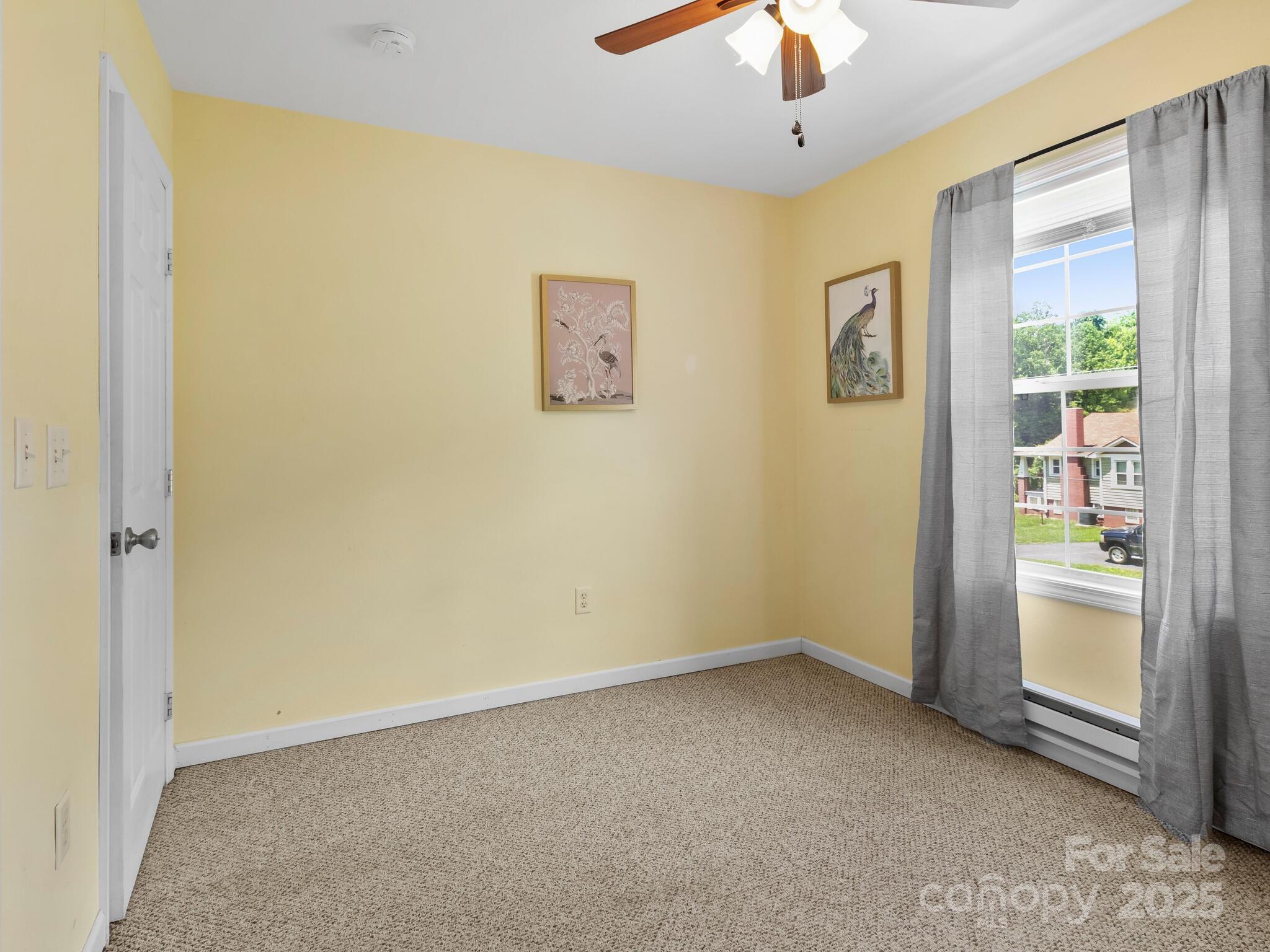 186 Wiggins Road Candler, NC 28715 - Photo 27 of 32 an empty room with a window