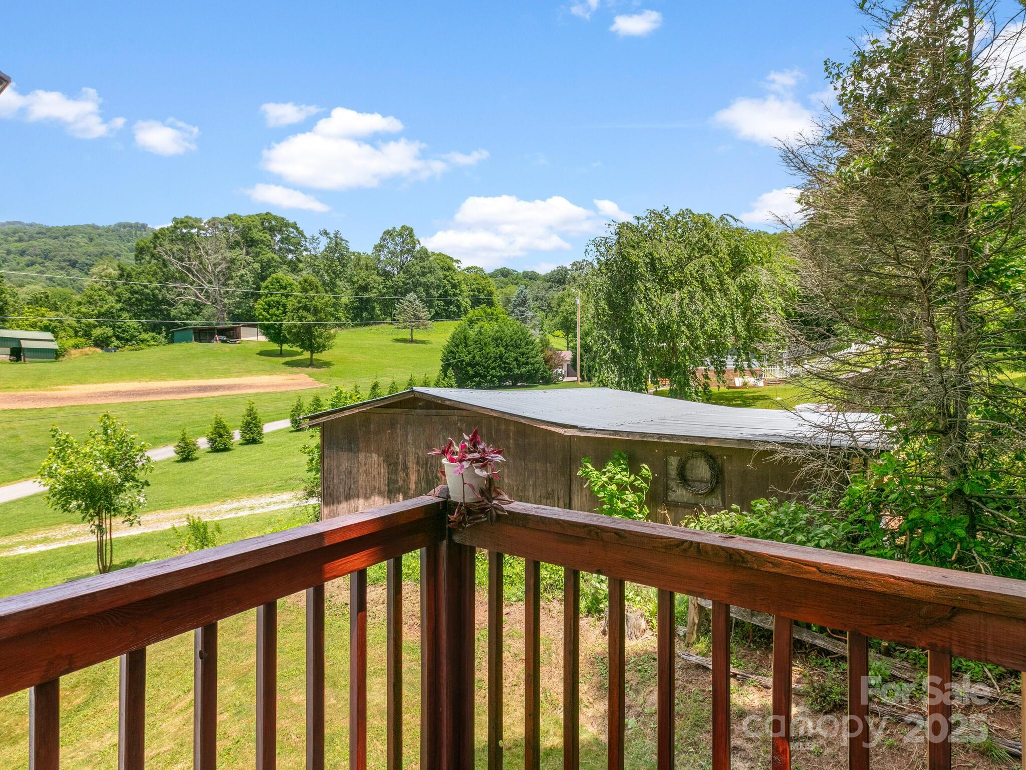 186 Wiggins Road Candler, NC 28715 - Photo 32 of 32 a view of a balcony with lake view