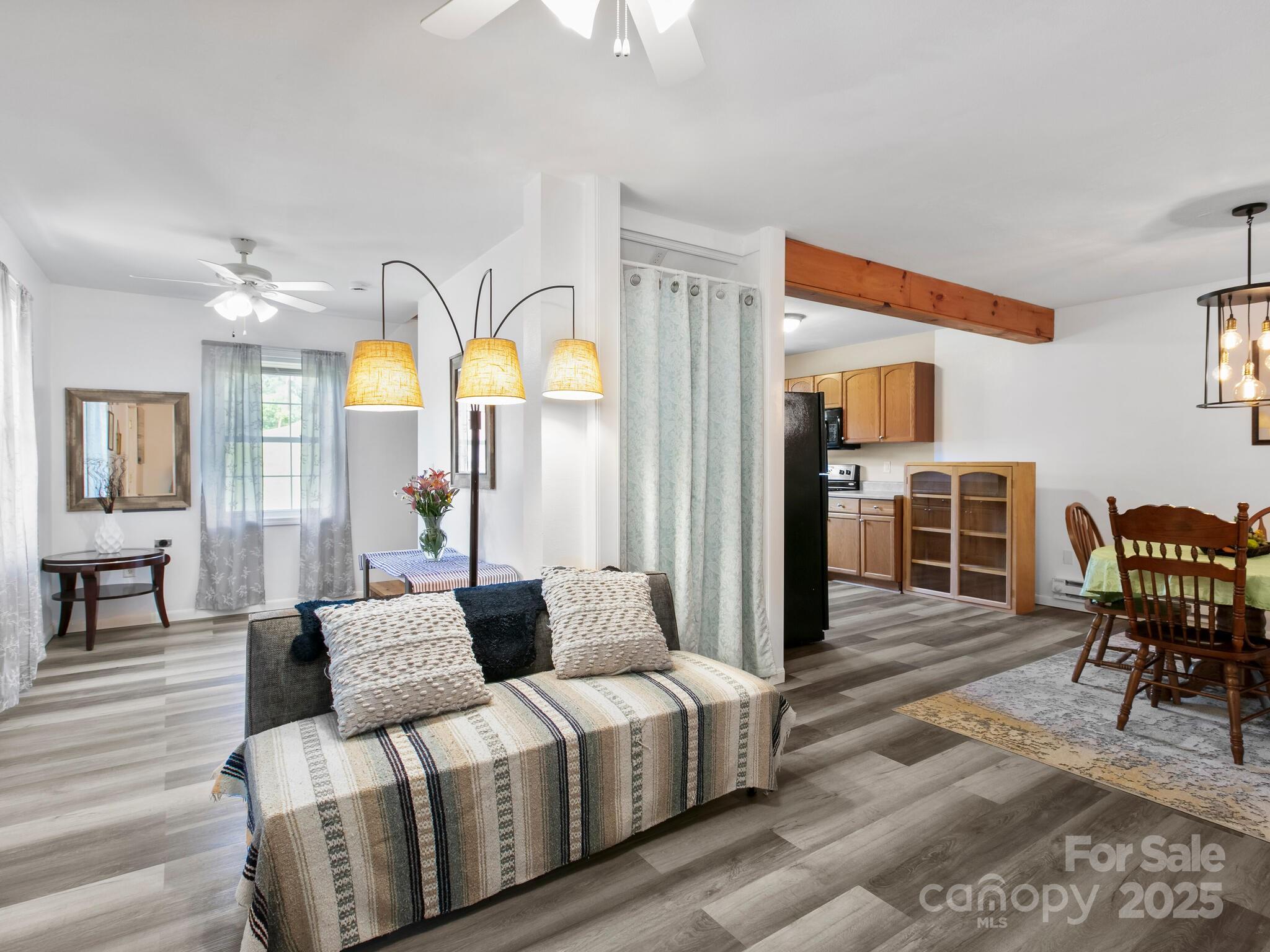 186 Wiggins Road Candler, NC 28715 - Photo 5 of 32 a living room with furniture and wooden floor