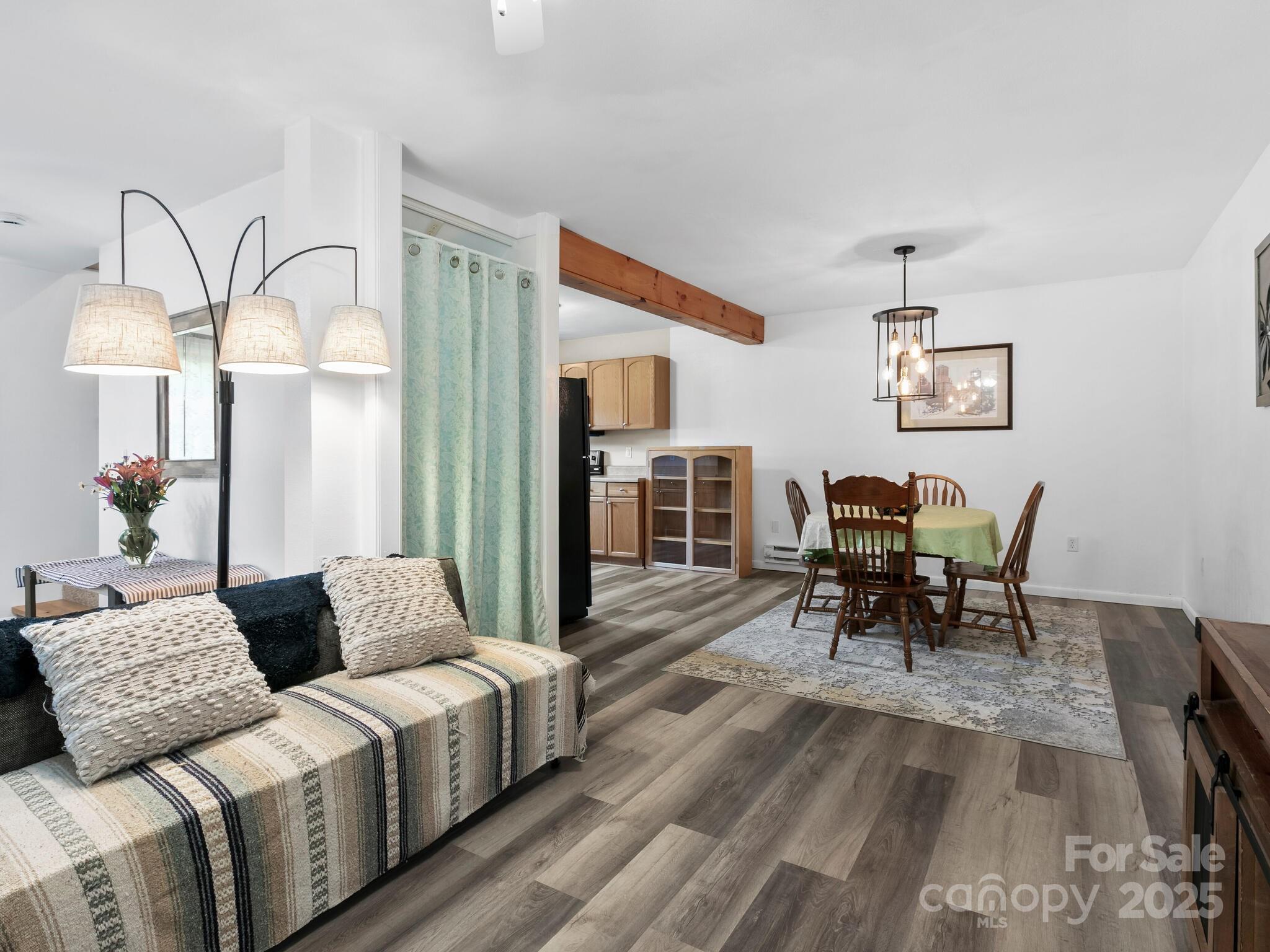 186 Wiggins Road Candler, NC 28715 - Photo 6 of 32 a living room with furniture and wooden floor