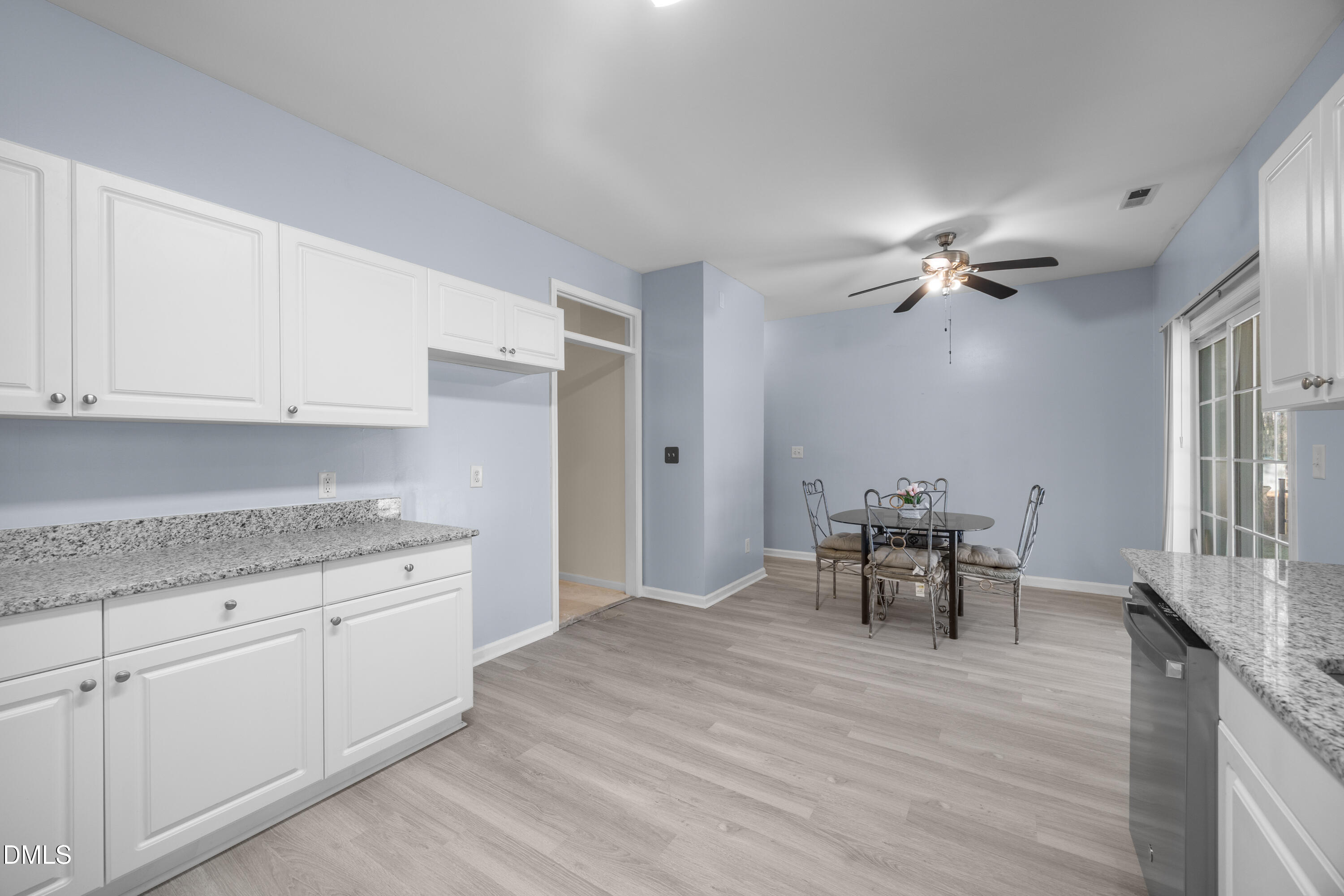 2109 Star Sapphire Drive Raleigh, NC 27610 - Photo 12 of 37 a view of dining table chairs and wooden floor