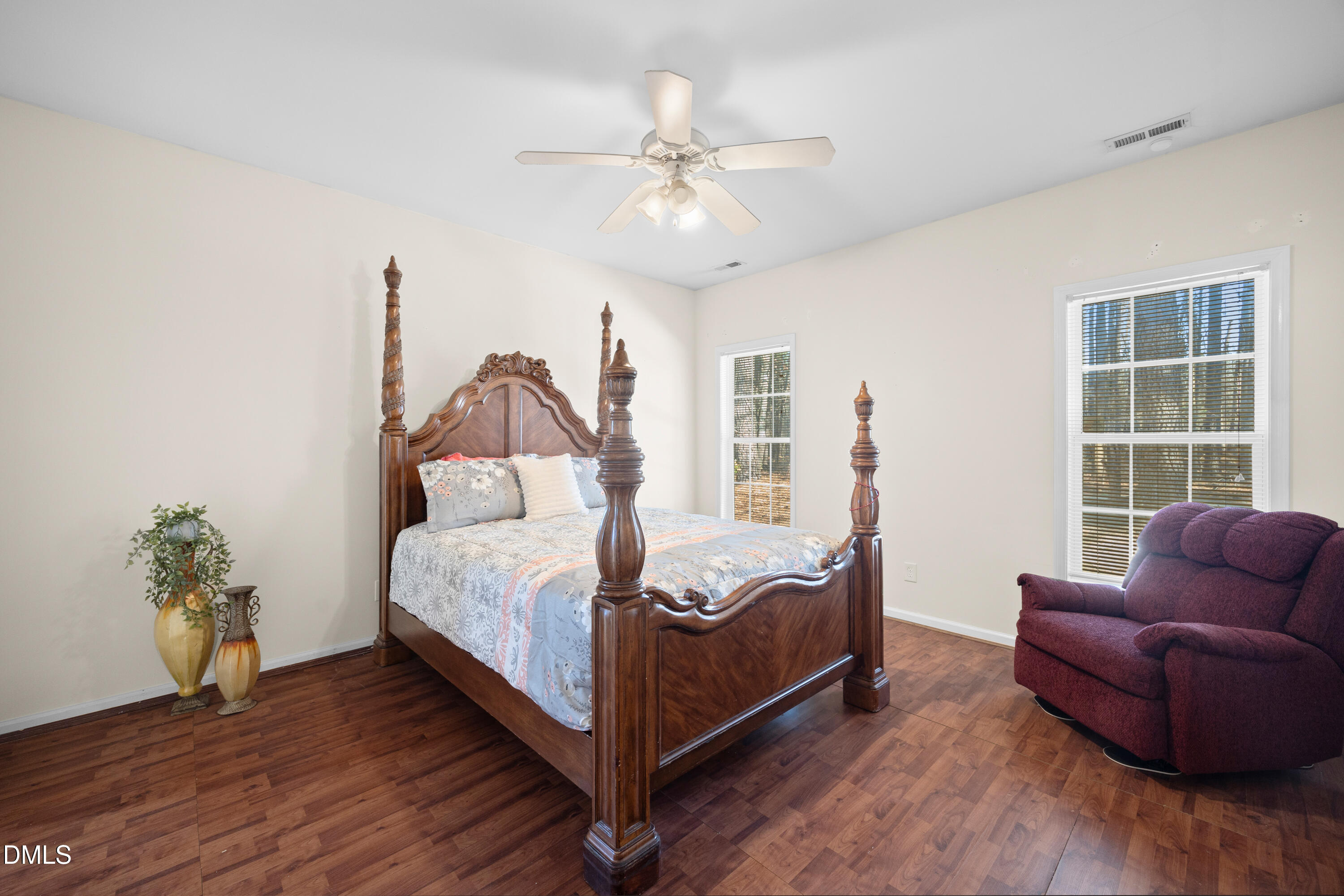 2109 Star Sapphire Drive Raleigh, NC 27610 - Photo 14 of 37 a bedroom with a bed couch and window