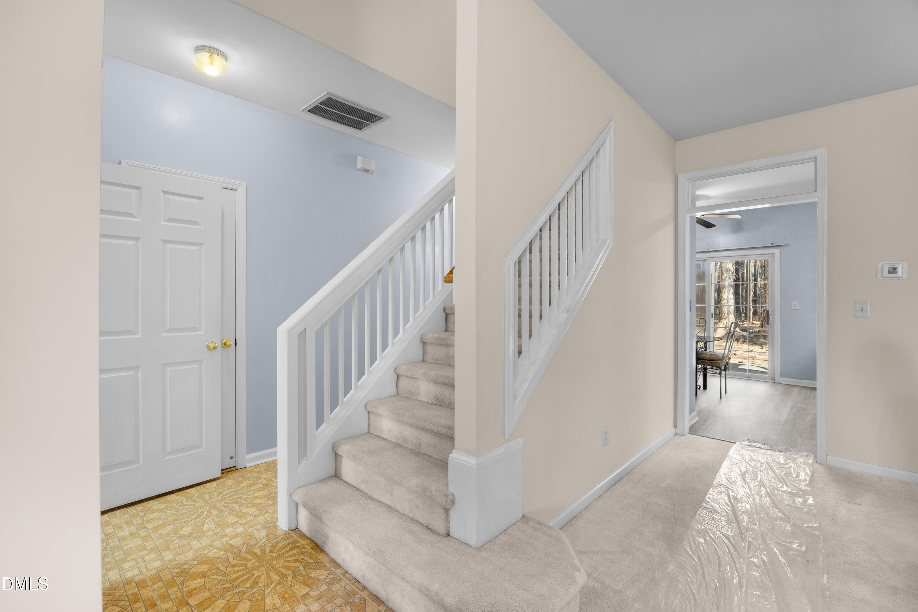 2109 Star Sapphire Drive Raleigh, NC 27610 - Photo 23 of 37 a view of entryway and hall with wooden floor
