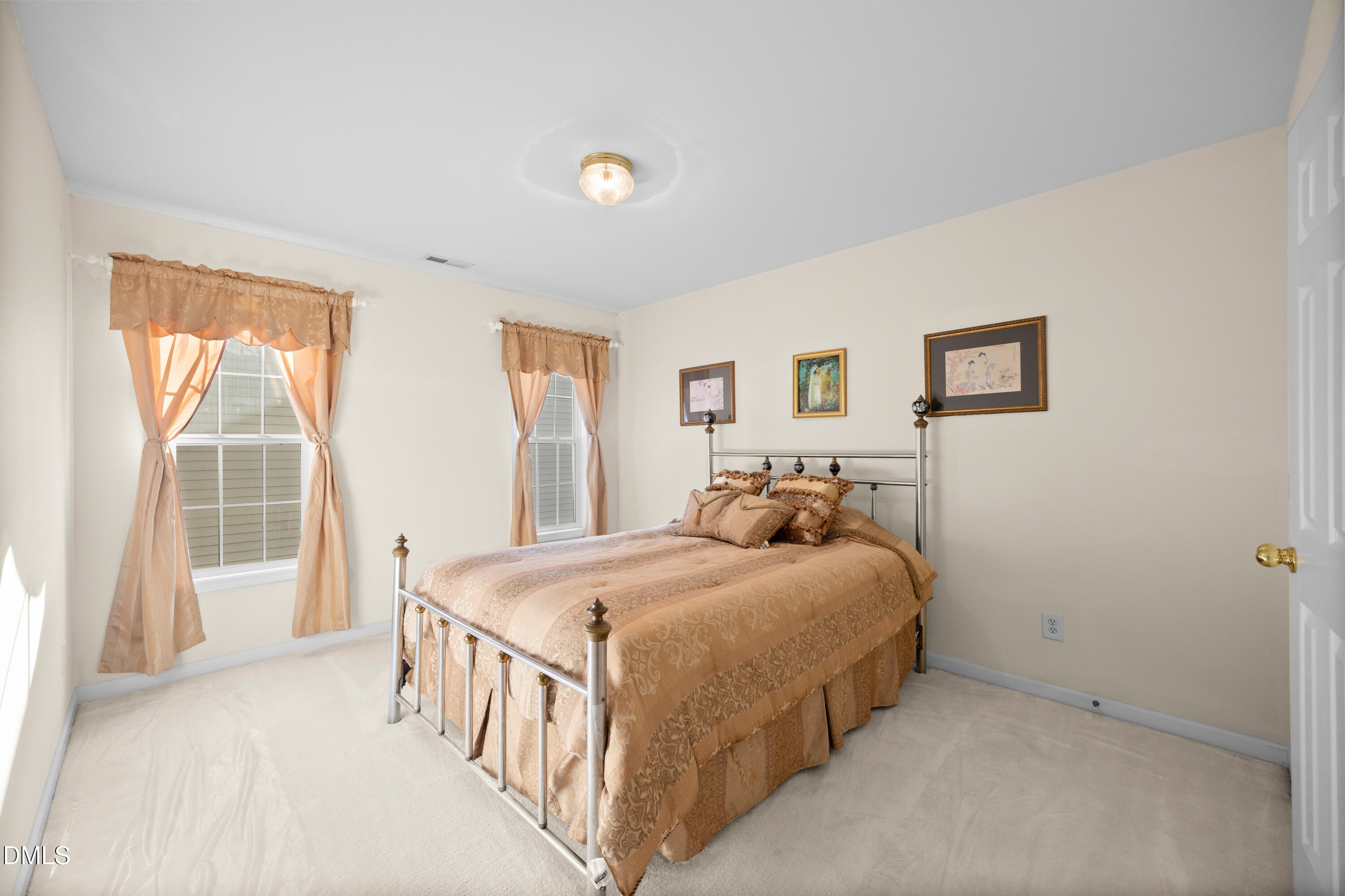 2109 Star Sapphire Drive Raleigh, NC 27610 - Photo 27 of 37 a bedroom with a bed and a window