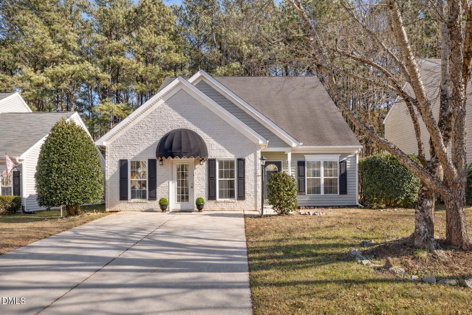 2109 Star Sapphire Drive Raleigh, NC 27610 - Photo 2 of 37 a front view of a house with a yard