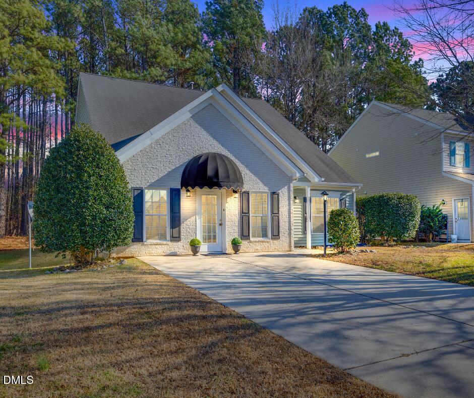 2109 Star Sapphire Drive Raleigh, NC 27610 - Photo 36 of 37 a front view of house with yard and green space