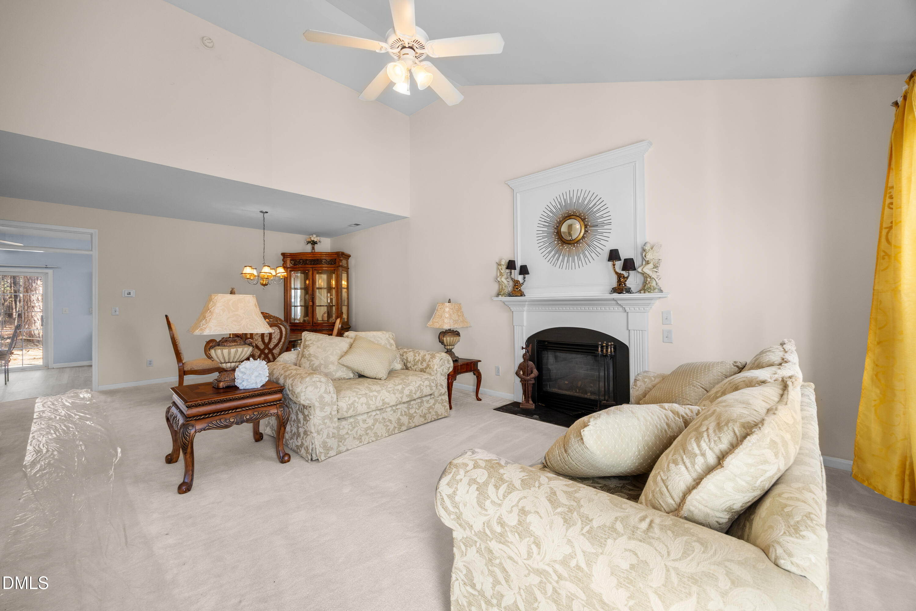 2109 Star Sapphire Drive Raleigh, NC 27610 - Photo 4 of 37 a living room with furniture and a fireplace