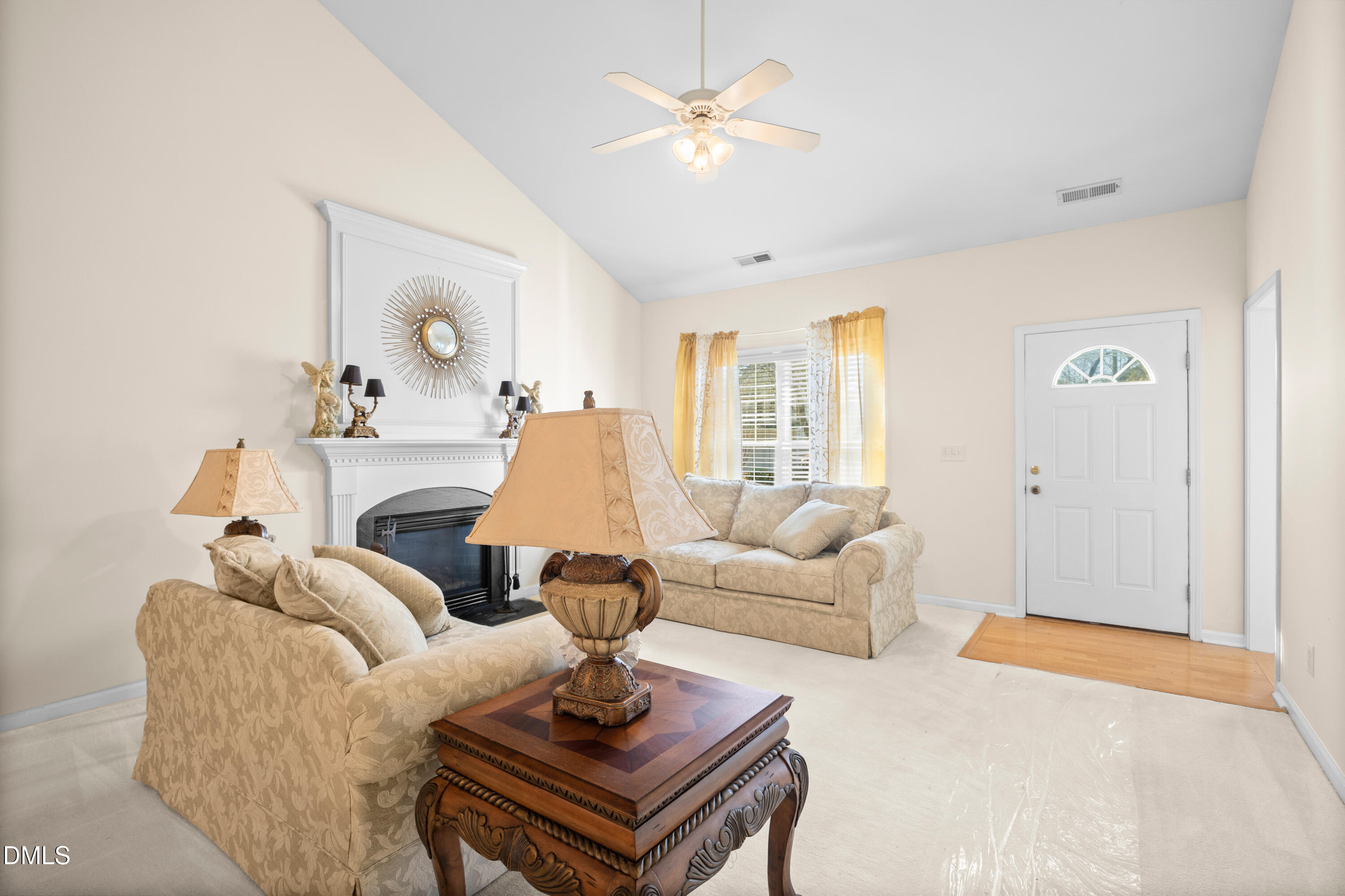 2109 Star Sapphire Drive Raleigh, NC 27610 - Photo 6 of 37 a living room with furniture and a large window