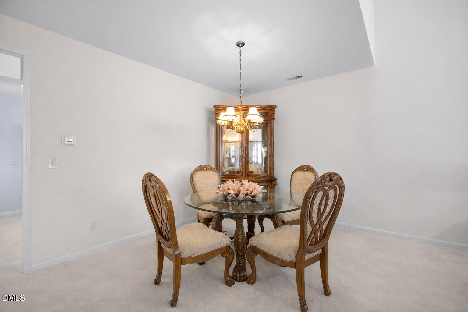 2109 Star Sapphire Drive Raleigh, NC 27610 - Photo 8 of 37 a dining room with furniture and window