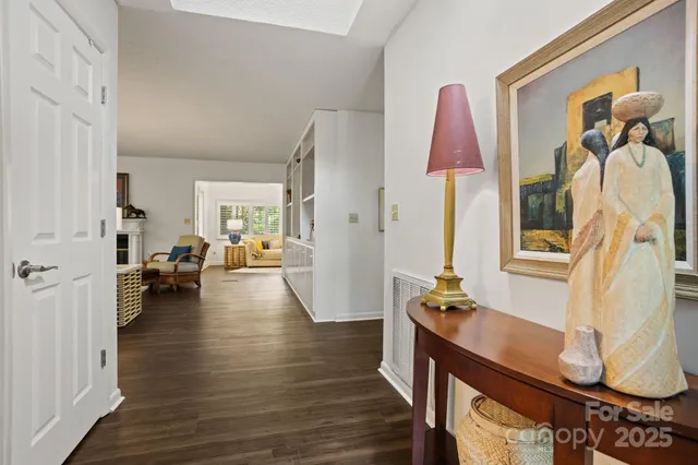 a view of living room filled with furniture and wooden floor