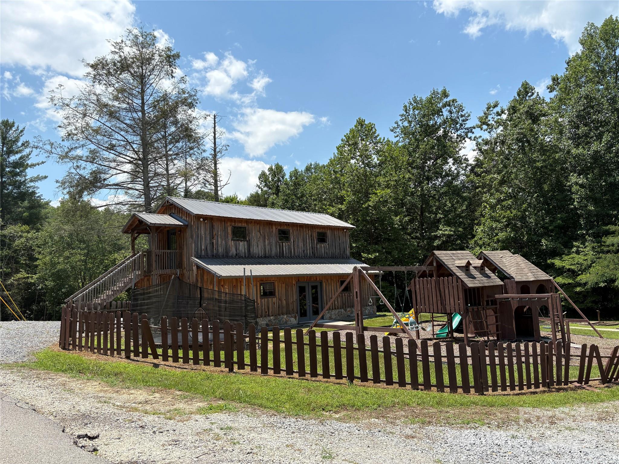 Lot 13 Wild Flower Way Marion, NC 28752 - Photo 12 of 16 a view of a house with wooden fence