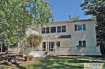 18 Skytop Road Edison, NJ 08820 - Photo 2 of 8 front view of a house with a yard