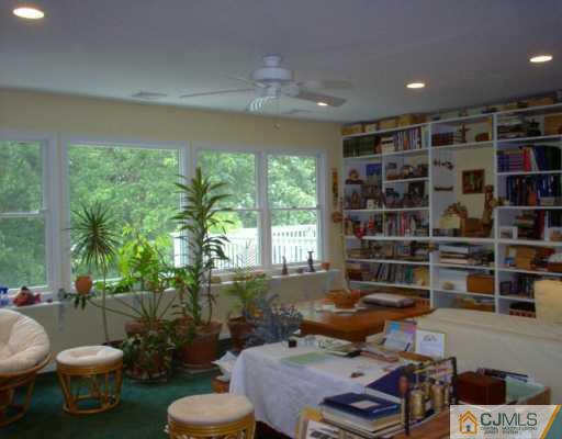 18 Skytop Road Edison, NJ 08820 - Photo 3 of 8 a living room with furniture and a floor to ceiling window