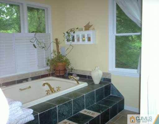 18 Skytop Road Edison, NJ 08820 - Photo 4 of 8 a bathroom with a sink and a bathtub