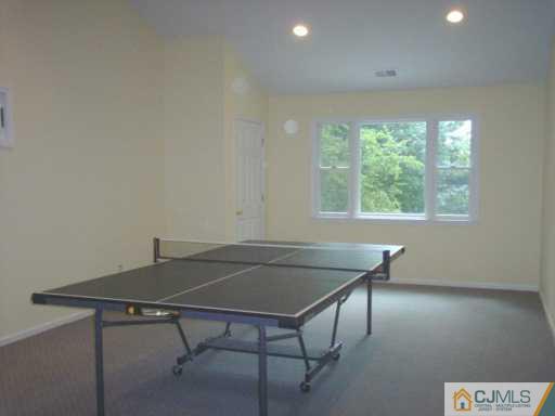 18 Skytop Road Edison, NJ 08820 - Photo 5 of 8 a view of a workspace with furniture and a window