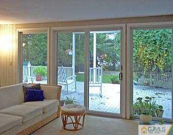 18 Skytop Road Edison, NJ 08820 - Photo 6 of 8 a living room with furniture and a garden