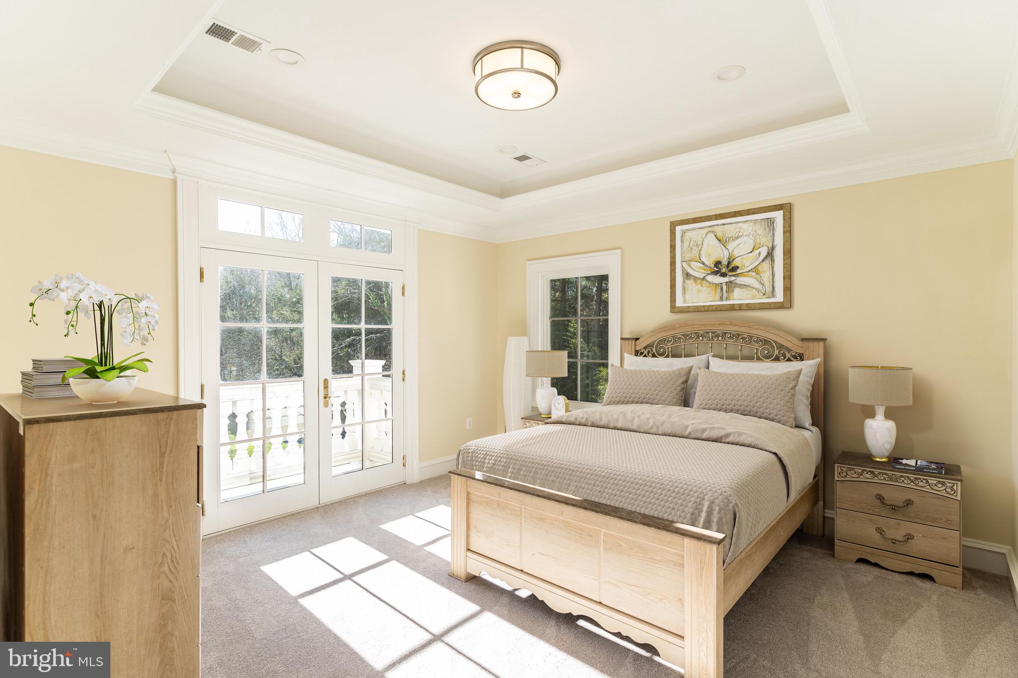 10110 Chapel Road Potomac, MD 20854 - Photo 20 of 28 a bedroom with a large bed and a window